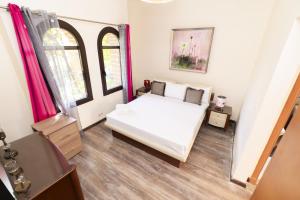 A bed or beds in a room at MARASSI VERONA VILLA by ELEGANT Hospitality
