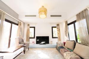 A seating area at MARASSI VERONA VILLA by ELEGANT Hospitality