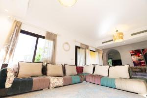 A seating area at MARASSI VERONA VILLA by ELEGANT Hospitality