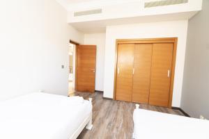 A bed or beds in a room at MARASSI VERONA VILLA by ELEGANT Hospitality