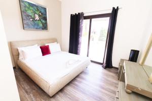 A bed or beds in a room at MARASSI VERONA VILLA by ELEGANT Hospitality