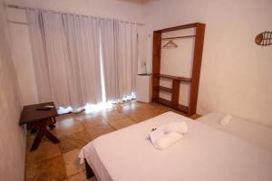 Postel nebo postele na pokoji v ubytování Palm Beach Pousada - Praia de Caetanos Quarto Casal ou Triplo