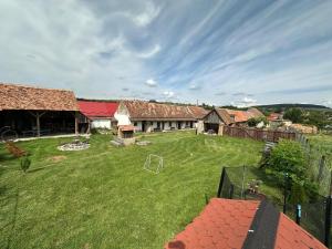 an aerial view of a yard with a soccer field at Casa pe Valea Hartibaciului(Bărcuț) in Bărcuţ