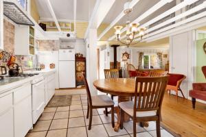 a kitchen and dining room with a table and chairs at Pines 23 #1438 in Big Bear Lake