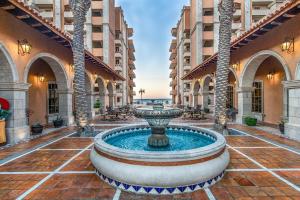 a large fountain in the middle of a courtyard at Sonoran Sun in Campo del Medio