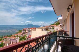 a balcony with a view of a city at Fedriades Delphi Hotel in Delfoi