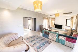 A television and/or entertainment centre at MARASSI VERONA VILLA by ELEGANT Hospitality