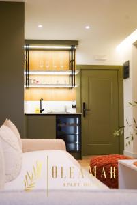 a bedroom with two beds and a green door at OleaMar in Bar