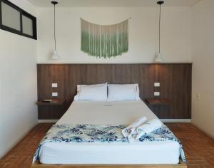 Postel nebo postele na pokoji v ubytování Hotel Macaw Cúcuta