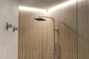 a shower with a shower head in a bathroom at Luxury Apartment Oceanografic 9 in Valencia