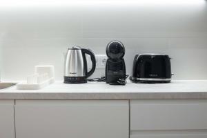 a kitchen counter with two appliances sitting on it at Luxury Apartment Oceanografic 9 in Valencia