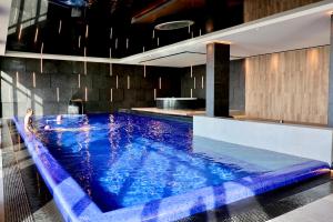 a large swimming pool in a building at Apartament 330 Przy Plaży, parking gratis! in Międzyzdroje +29 photos