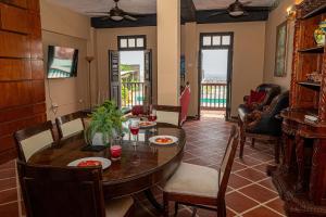a dining room with a table and chairs at Penthouse with Private Rooftop! in San Juan