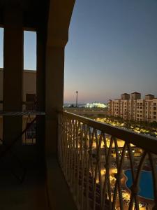 a balcony of a building with a view of a city at Aqua View Studio in Dawwār Abū Maḩrūs