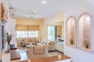 a living room with a couch and a table at Punta Piedra By Andiani in Cancún +46 photos