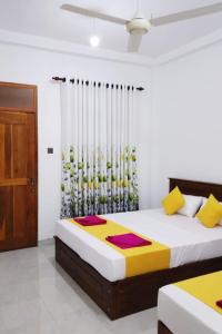 Ένα ή περισσότερα κρεβάτια σε δωμάτιο στο Sigiri Garden Villa