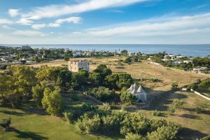 an aerial view of a small town with the ocean at Cala Ponte, a Tribute Portfolio Hotel in Polignano a Mare