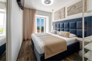 a hotel room with a large bed and a window at Villa Tea in Cavtat +40 photos