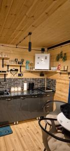 a kitchen with a counter and a table in a room at Hiking in Jut'a +67 photos