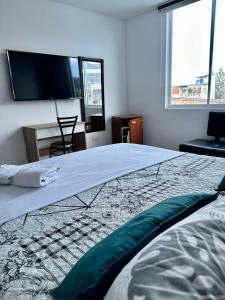 Postel nebo postele na pokoji v ubytování hotel royal fenix