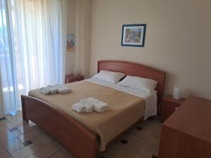 Ένα ή περισσότερα κρεβάτια σε δωμάτιο στο Angelina's HOUSE