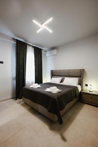 Postel nebo postele na pokoji v ubytování Siel simple elegance Volos
