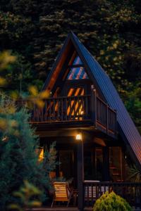 a log cabin with a balcony and a deck at MC Sapanca Hotel in Sakarya