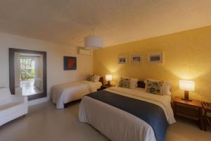 Katil atau katil-katil dalam bilik di Hotel Maitei +37 gambar