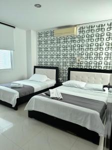 Postel nebo postele na pokoji v ubytování hotel royal fenix
