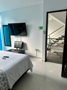Postel nebo postele na pokoji v ubytování hotel royal fenix