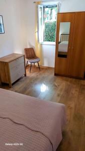 Postel nebo postele na pokoji v ubytování Apartments Nada