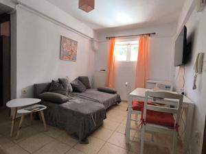 a living room with a couch and a table at Johanna's apartment in Preveza