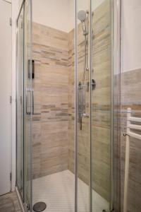 a shower with a glass door in a bathroom at Casa Antonietta - relax a Macerata in Macerata +15 photos