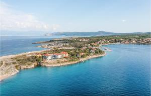 an aerial view of an island in the water at 1 Bedroom Beach Front Apartment In Silo in Šilo