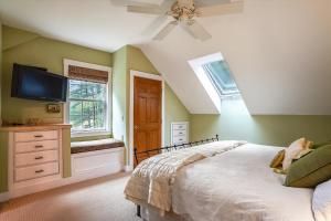 a bedroom with a bed and a ceiling fan at Grey Goose Farm in Morrisville +36 photos