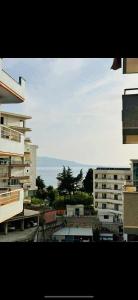 a view from a window of a city with buildings at Tranquility Apartment in Sarandë