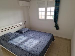 Postel nebo postele na pokoji v ubytování HARMONY Appart Type Penthouse avec vue imprenable