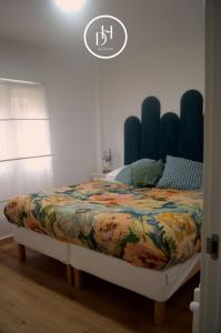 Ένα ή περισσότερα κρεβάτια σε δωμάτιο στο DH Apartamento Turistico