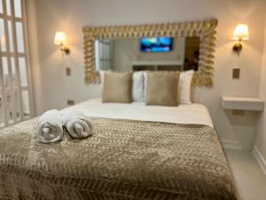 Postel nebo postele na pokoji v ubytování Ataraxy Hotel Boutique + 89 fotografií