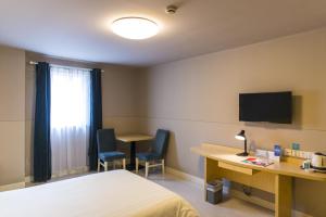 Llit o llits en una habitació de Jinjiang Inn - Shanghai Nanxiang