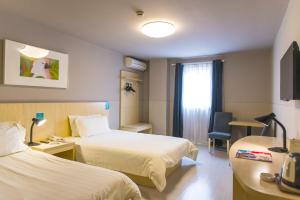 Llit o llits en una habitació de Jinjiang Inn - Shanghai Nanxiang
