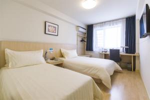 Llit o llits en una habitació de Jinjiang Inn - Shanghai Nanxiang