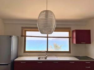 Η κουζίνα ή μικρή κουζίνα στο Lazareto Oceanview