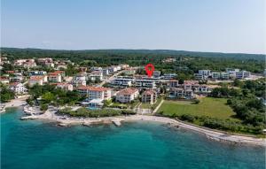 an aerial view of a resort on a beach at Cozy Apartment In Malinska With Wifi in Malinska +16 photos