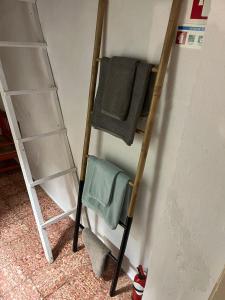 a couple of ladder shelves in a room at Casa na aldeia in Albernoa +36 photos