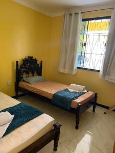 Postel nebo postele na pokoji v ubytování Casa para aluguel de temporada