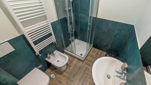 a bathroom with a toilet and a shower and a sink at Conca D'Oro Guest House - Elisabetta in Rome