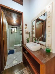 a bathroom with a sink and a toilet at Pousada Bela Vista in Abraão +218 photos