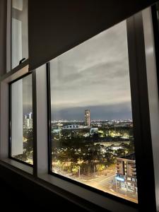 a view of a city from a window at Luxurious city view at Sydney Olympic Park in Sydney