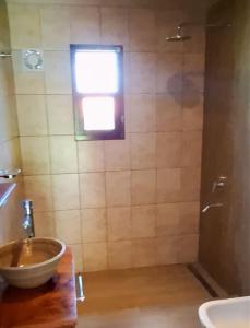a bathroom with a sink and a shower at Barcena Houses in Tumbaya +10 photos